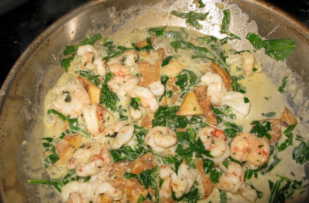 Shrimp, chanterelles, spinach, butter and cream over pasta